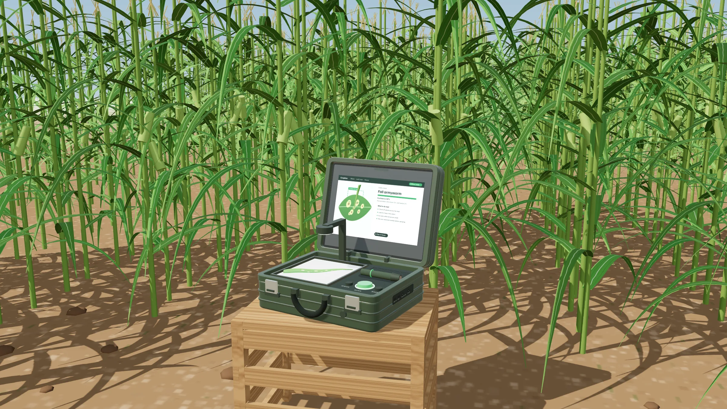 The CropVox field station open on a wooden crate at the edge of a maize field, showing a fall armyworm result on screen